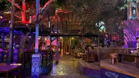 Night-time lounge and bar area with neon lighting at Hatch Bar in Bali — salsa, bachata venue in Bali