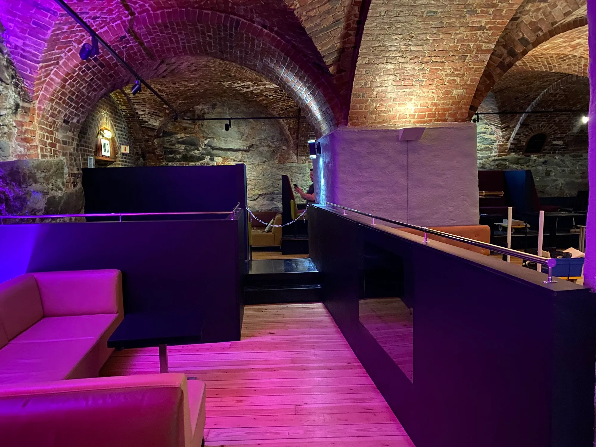 ME Nightclub stone vault cellar interior with purple club lighting in Trondheim Norway