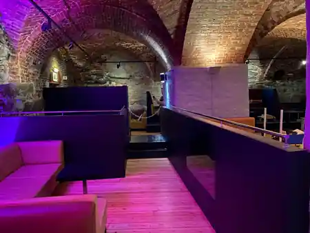 ME Nightclub stone vault cellar interior with purple club lighting in Trondheim Norway — salsa, bachata, kizomba venue in Trondheim
