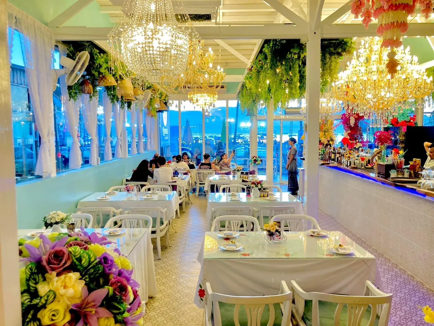 Guests dining at Romsai Brasserie with elegant table settings near Pattaya Beach Road