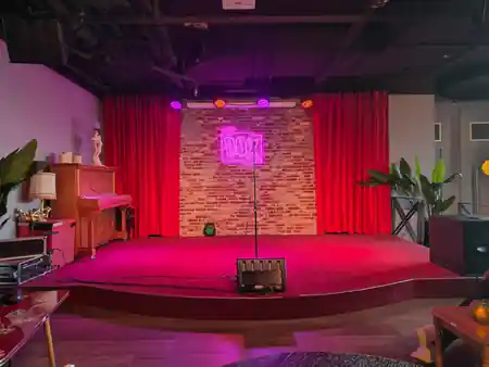 THE DOX neon-lit stage with red curtains at Rotterdam Netherlands salsa venue