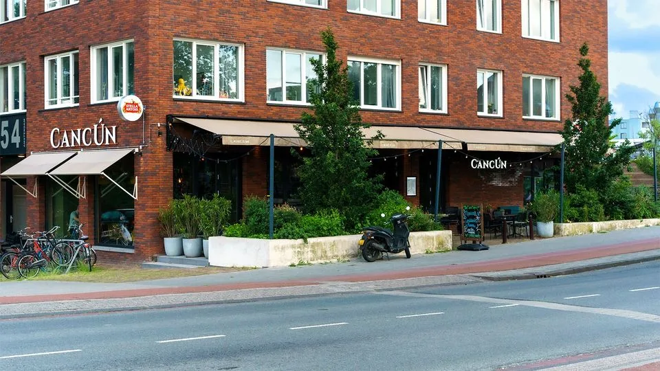 Restaurant Cancún Amsterdam exterior with branded signage on brick corner building