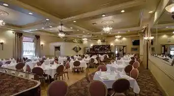 Caps Oak Street Bar and Grill elegant banquet room with warm lighting in Brentwood — salsa, bachata venue in Brentwood