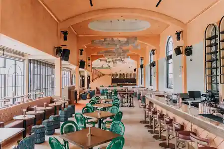 Coral-walled dining hall with chandeliers and bar at Amavi venue in Canggu, Bali — bachata, kizomba, salsa venue in Bali