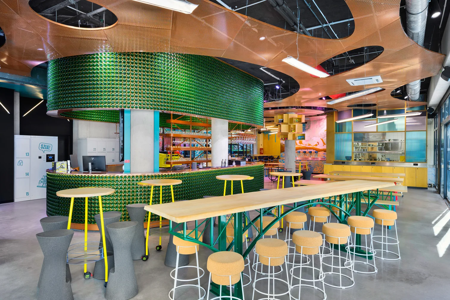 Colorful interior bar and lounge area at JO&JOE Budapest with distinctive green tile design — salsa, bachata venue in Budapest