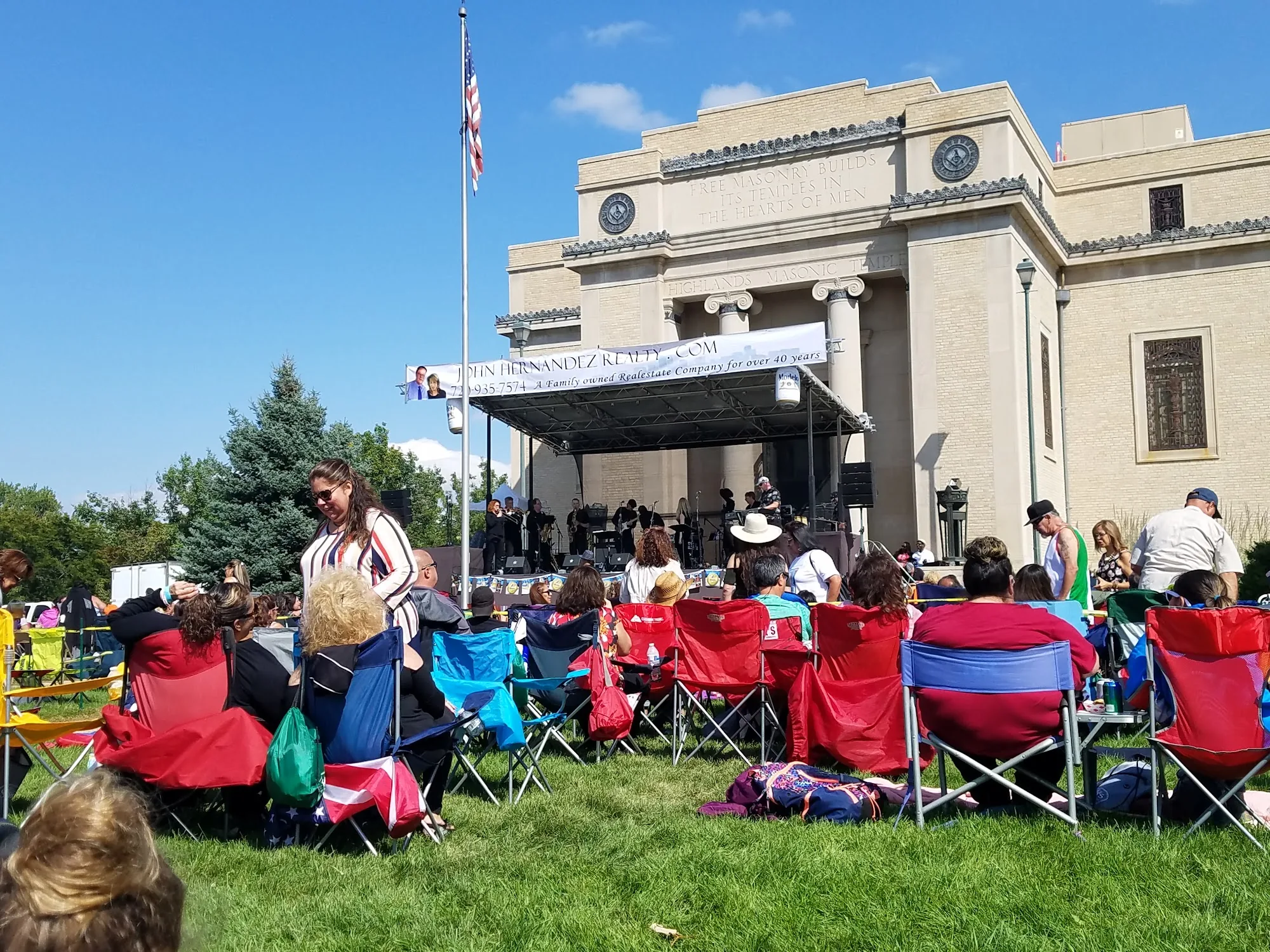 Outdoor concert crowd and live band on the lawn at Highlands Event Center, Denver