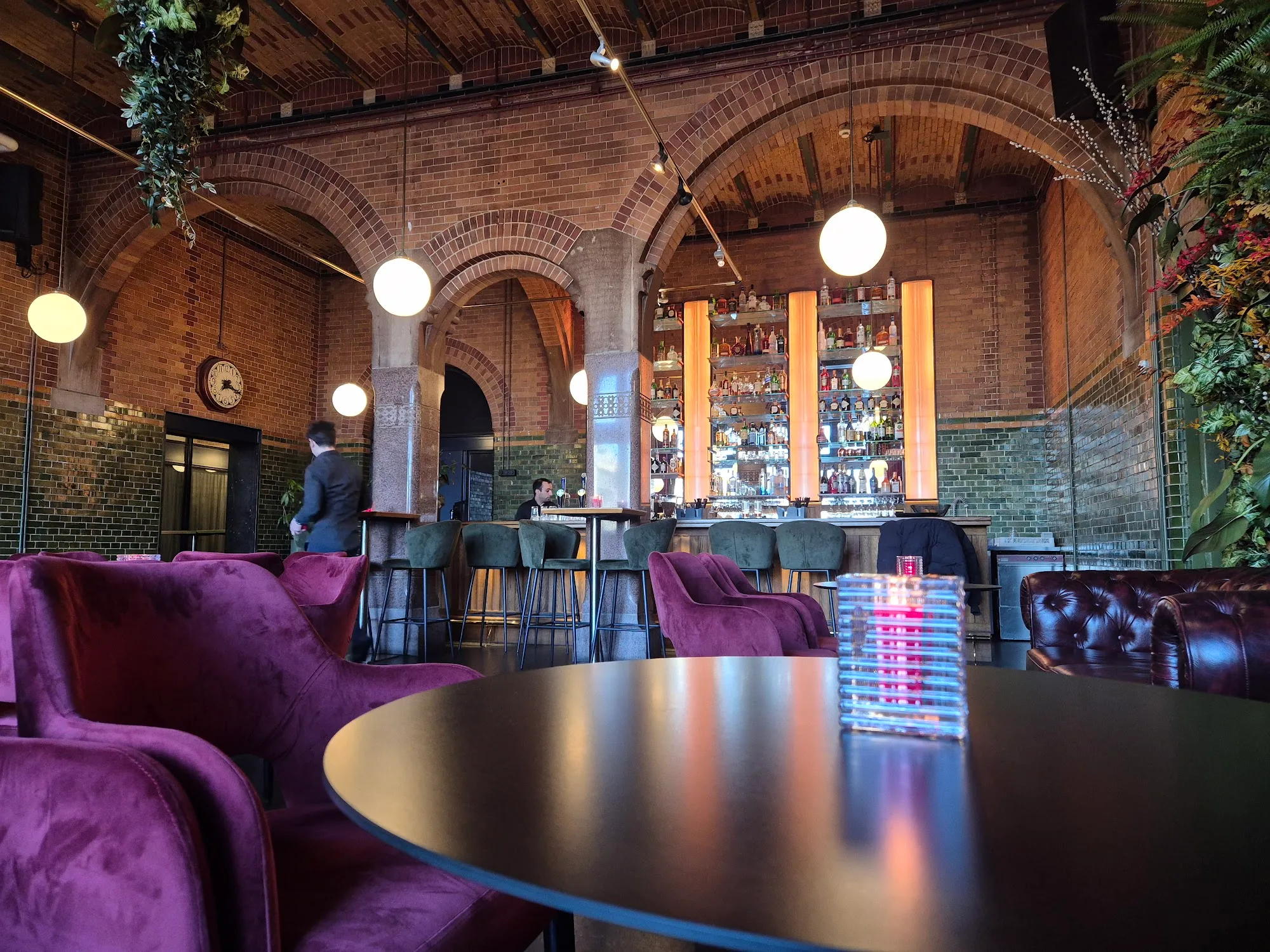Grand arched brick interior and bar at The Brokers Bar in Amsterdam