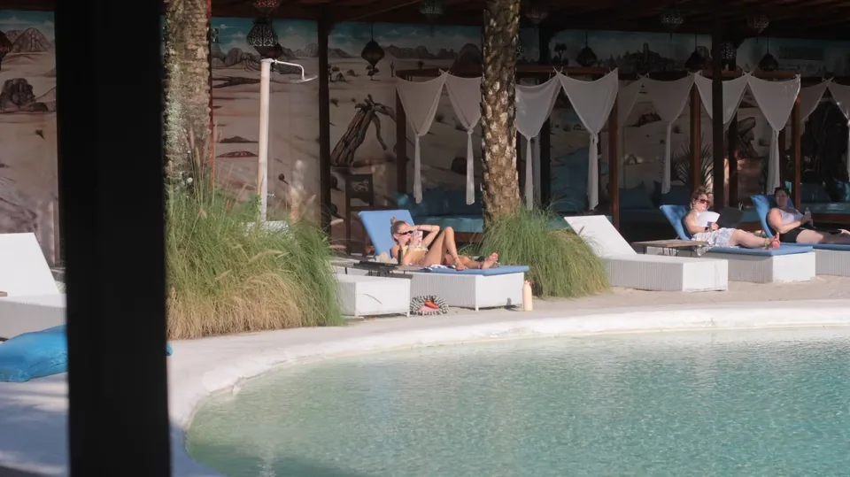 Pool deck with cabanas and sunbeds at CP Lounge Ubud, Bali