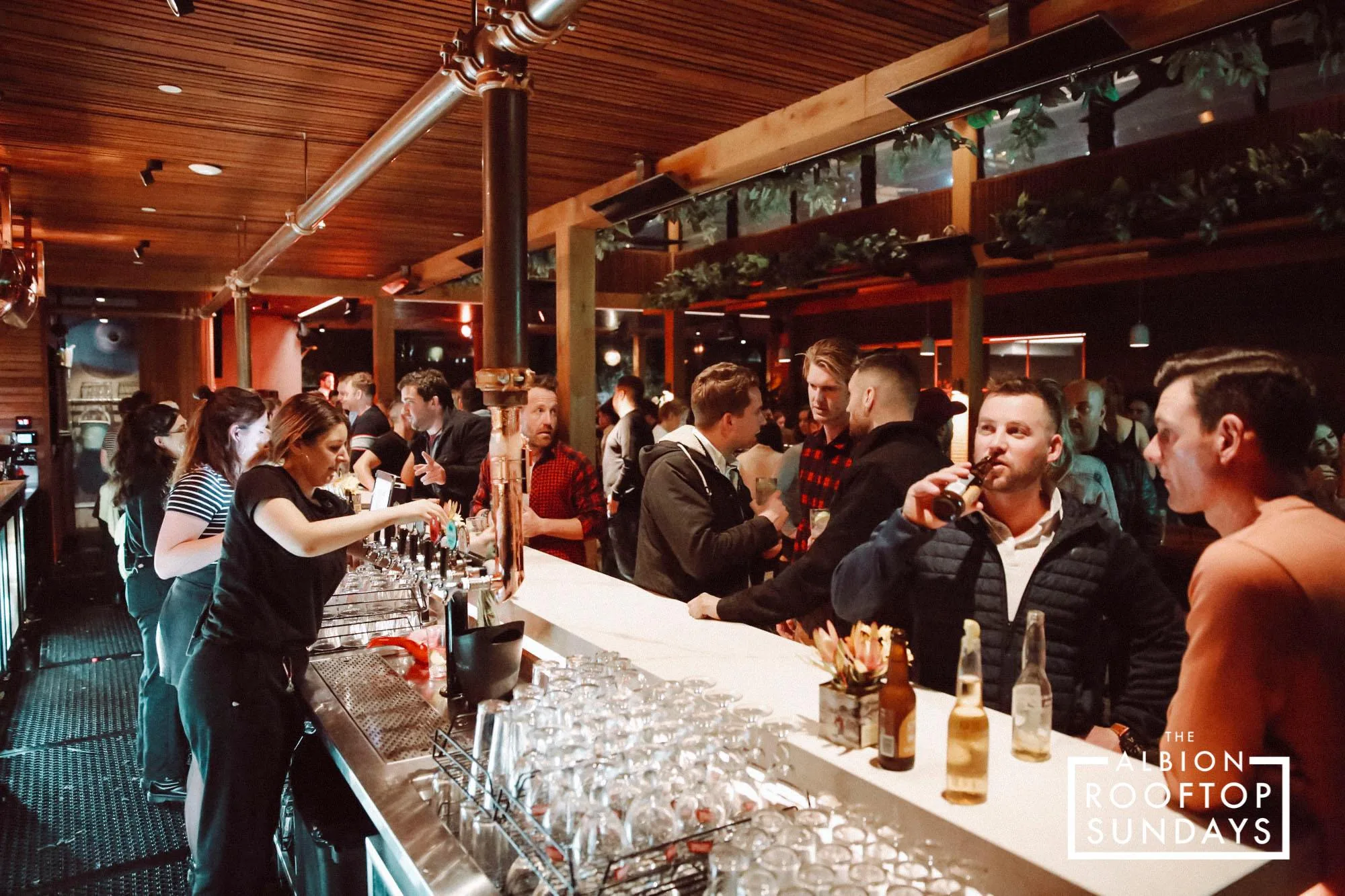 Lively rooftop bar crowd at The Albion Rooftop venue in Melbourne — bachata, salsa, reggaeton venue in Melbourne