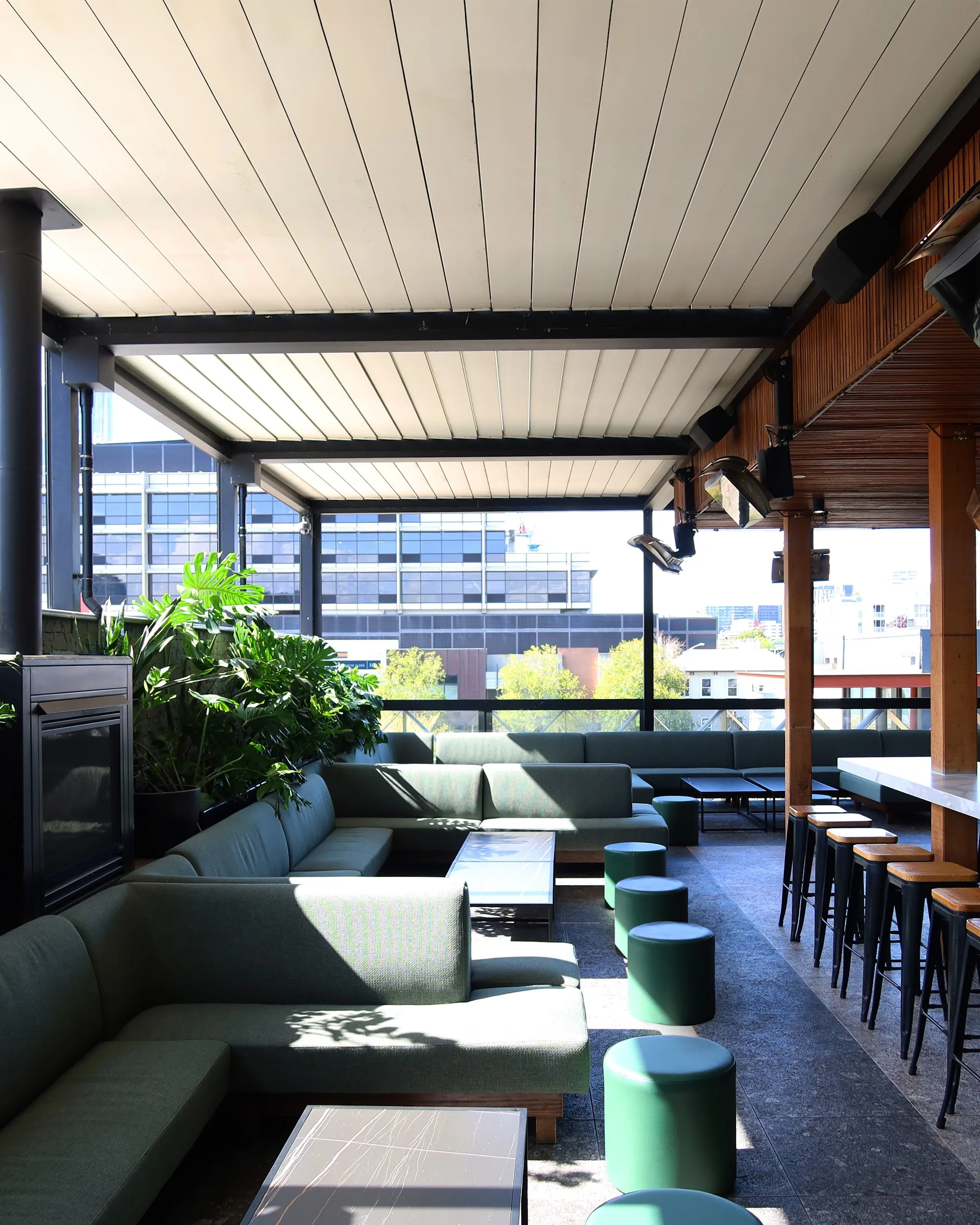 Open-air rooftop lounge area with city views at The Albion Melbourne