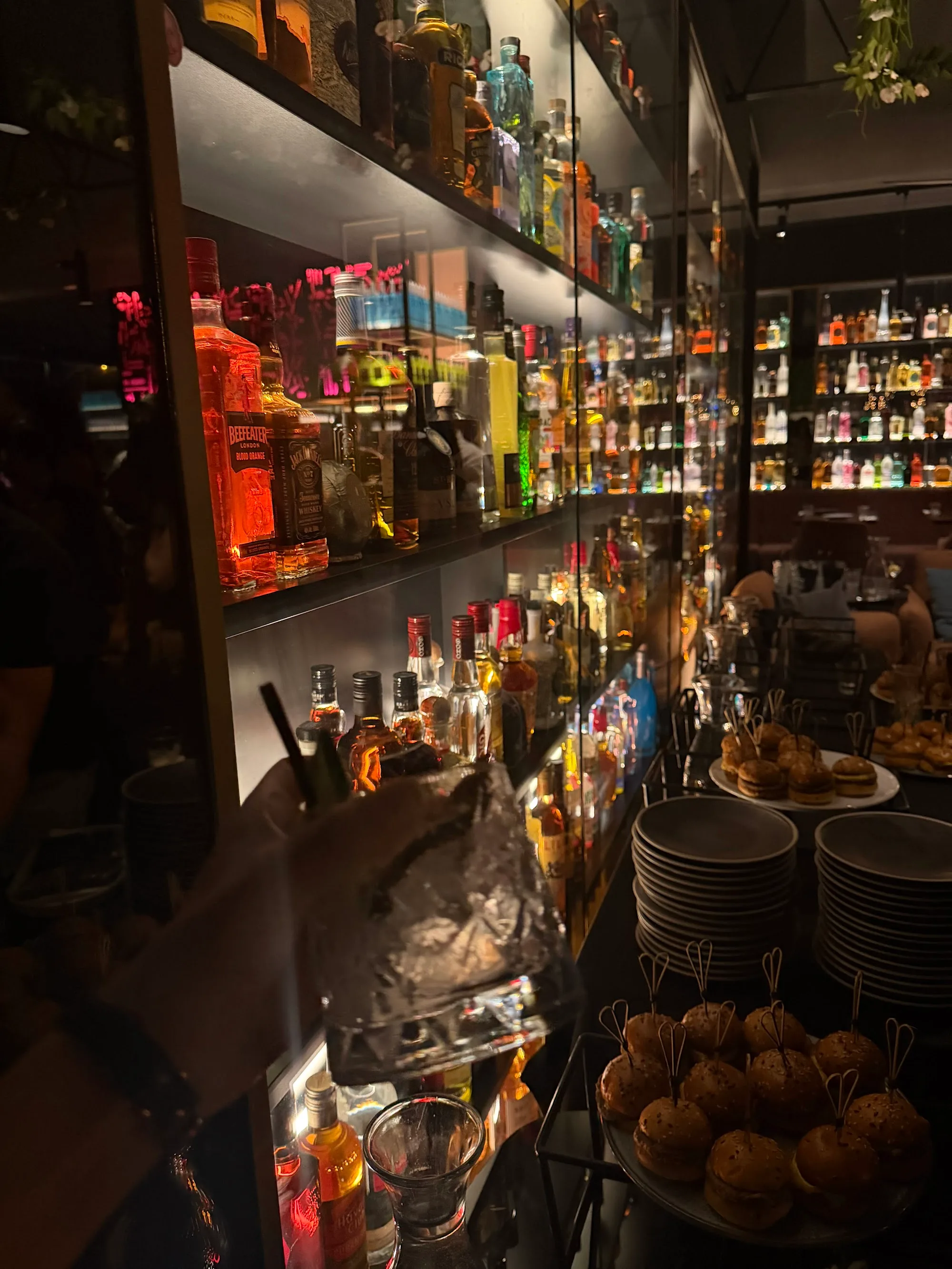 Backlit bar shelves with spirit bottles at The Albion Rooftop Melbourne