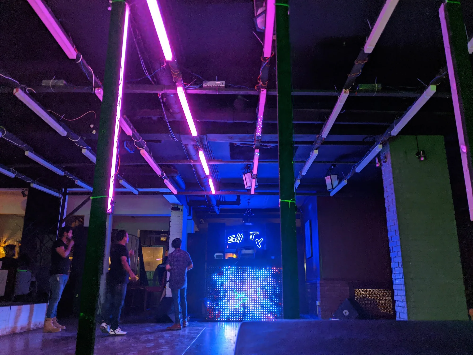 Club 432 Karachi dance floor with neon lighting and DJ setup