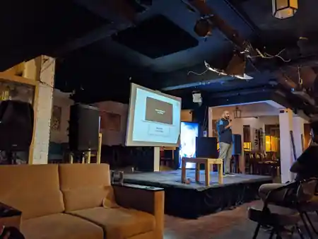 Club 432 Karachi lounge interior with exposed brick and stage setup — bachata venue in Karachi