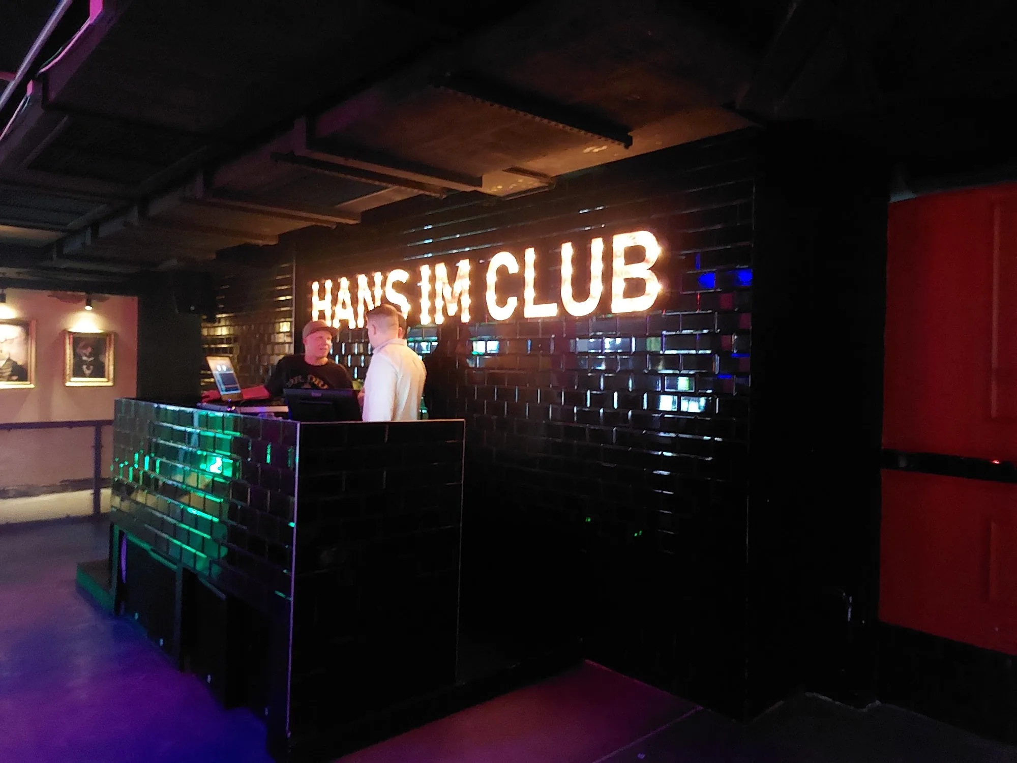 Hans im Club neon sign DJ booth with club lighting in Dresden