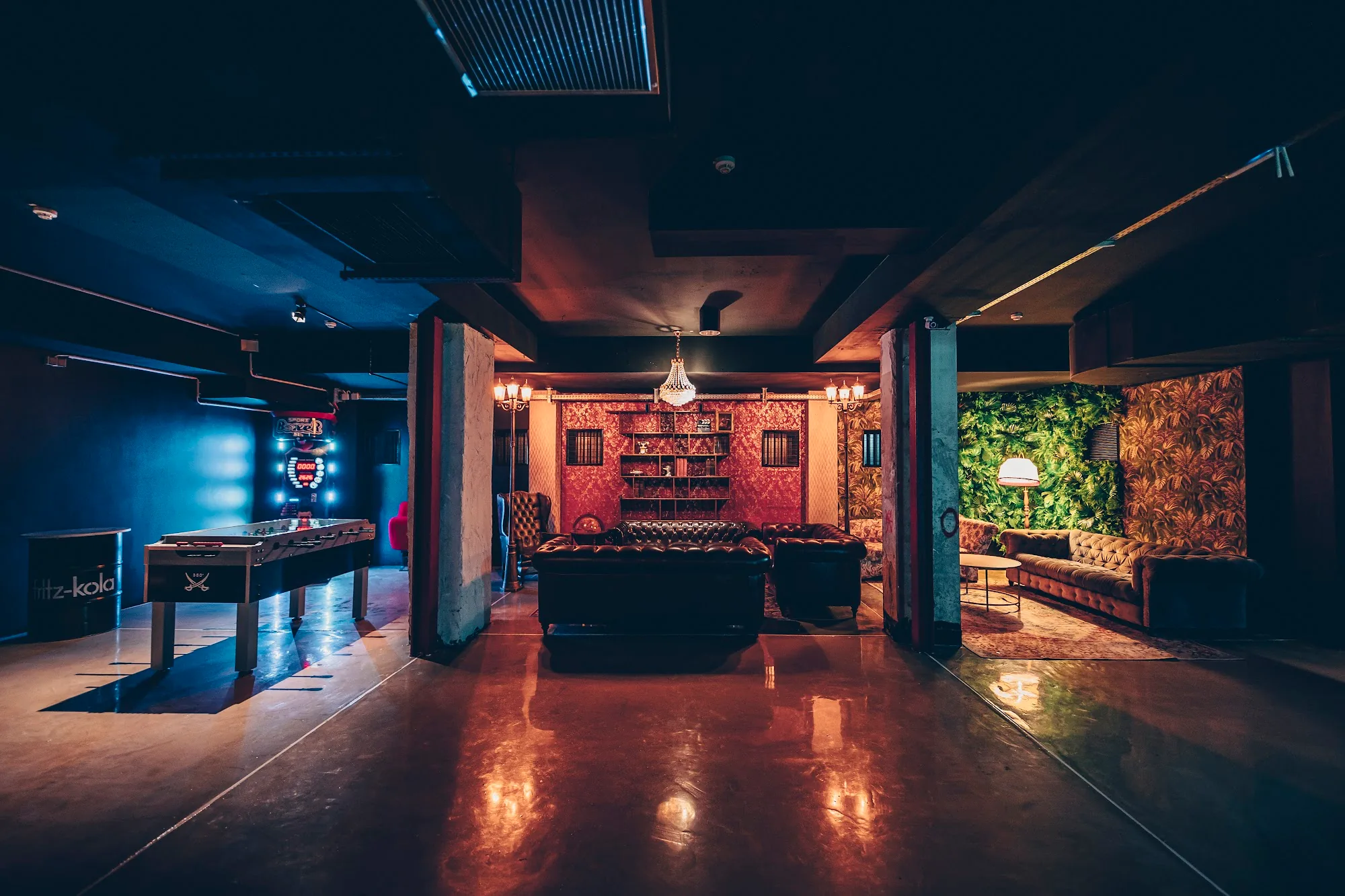 Club lounge area with leather sofas and dance floor at Hans im Club Dresden