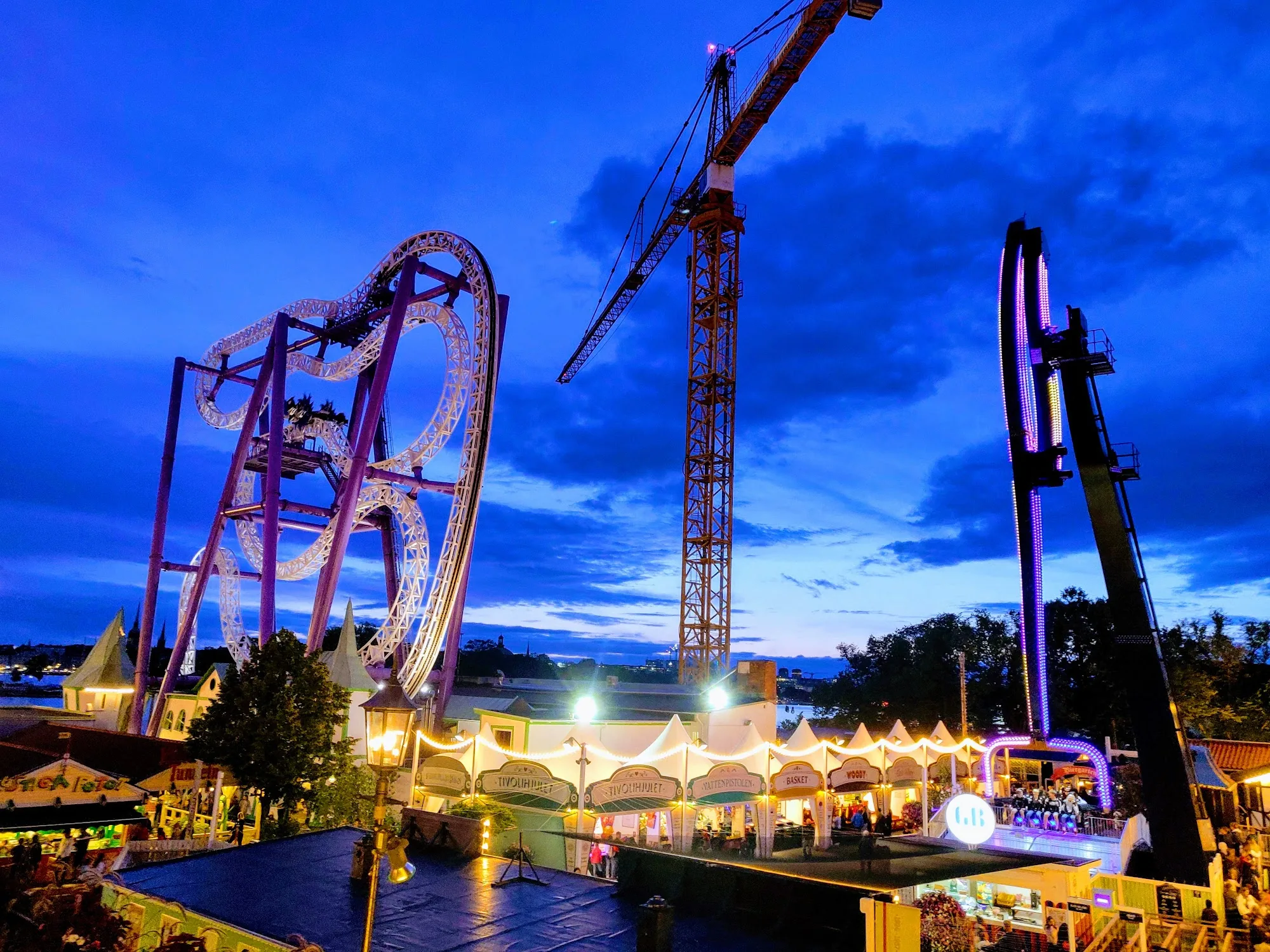 Gröna Lund amusement park rides and event venue lit up at night in Stockholm