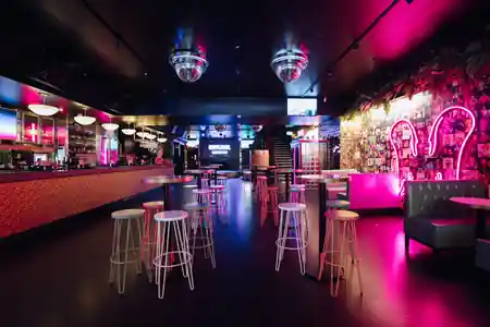 Dance floor with disco balls and neon lighting at Universal Sydney salsa venue