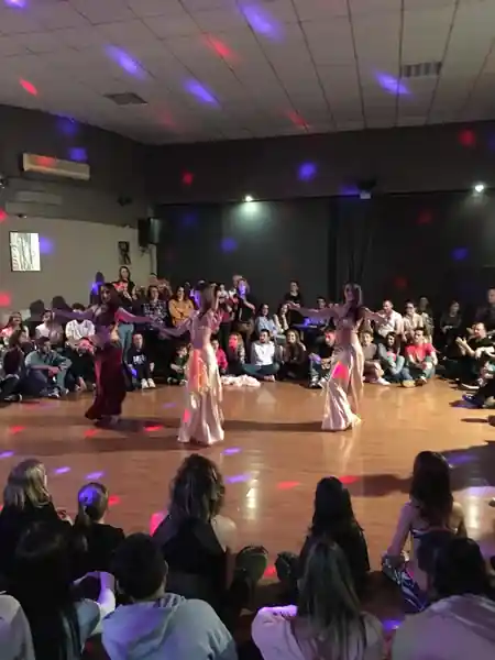 Dance performance with audience at Sala Ritmo Córdoba with disco ball lights — salsa, bachata venue in Córdoba