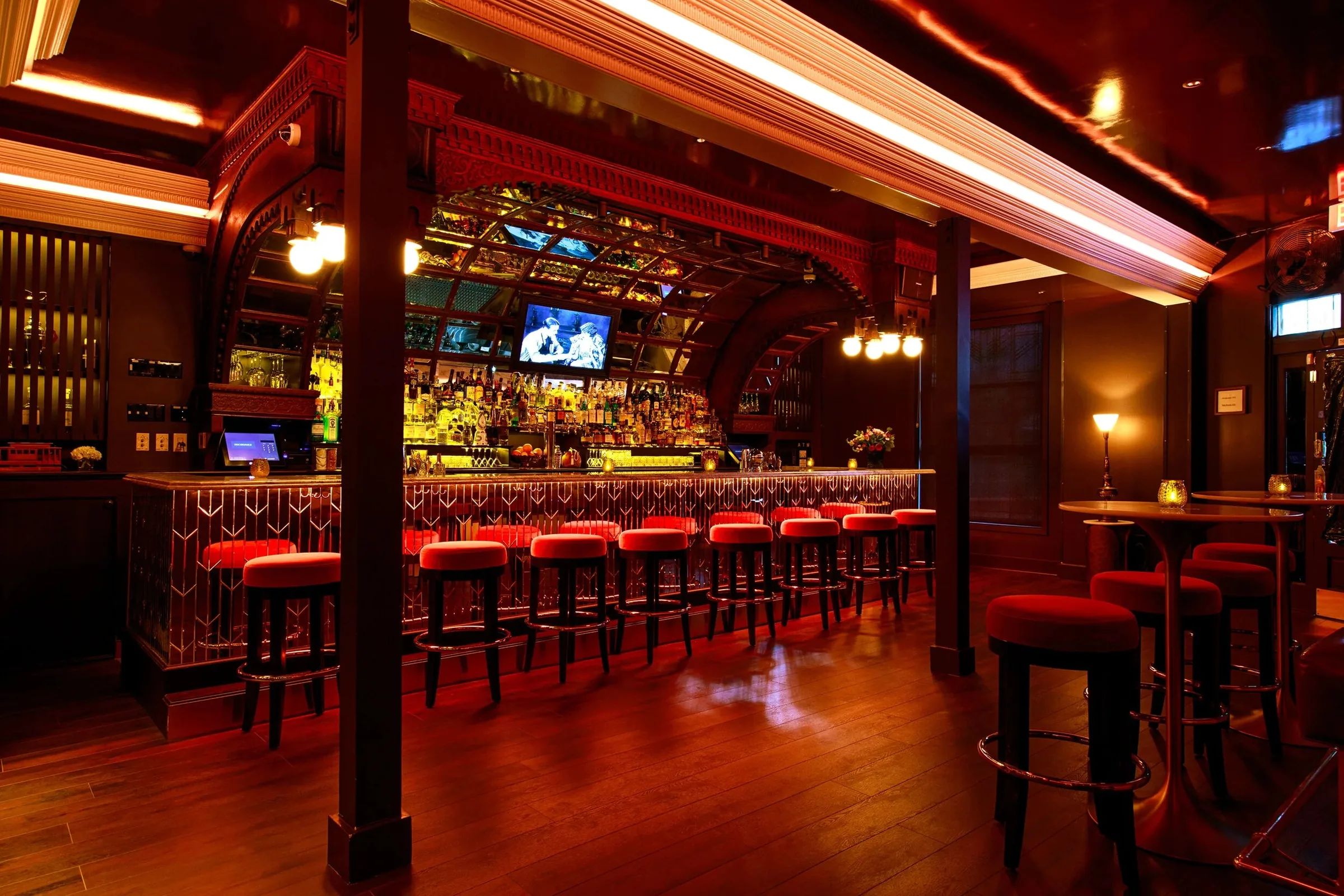 DecoDance Bar interior in San Francisco showing the art deco bar, hardwood dance floor, and warm ambient lighting for Latin dance nights