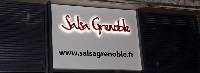 Salsa Grenoble venue exterior sign with website address on building facade