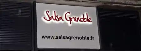 Salsa Grenoble venue exterior sign with website address on building facade
