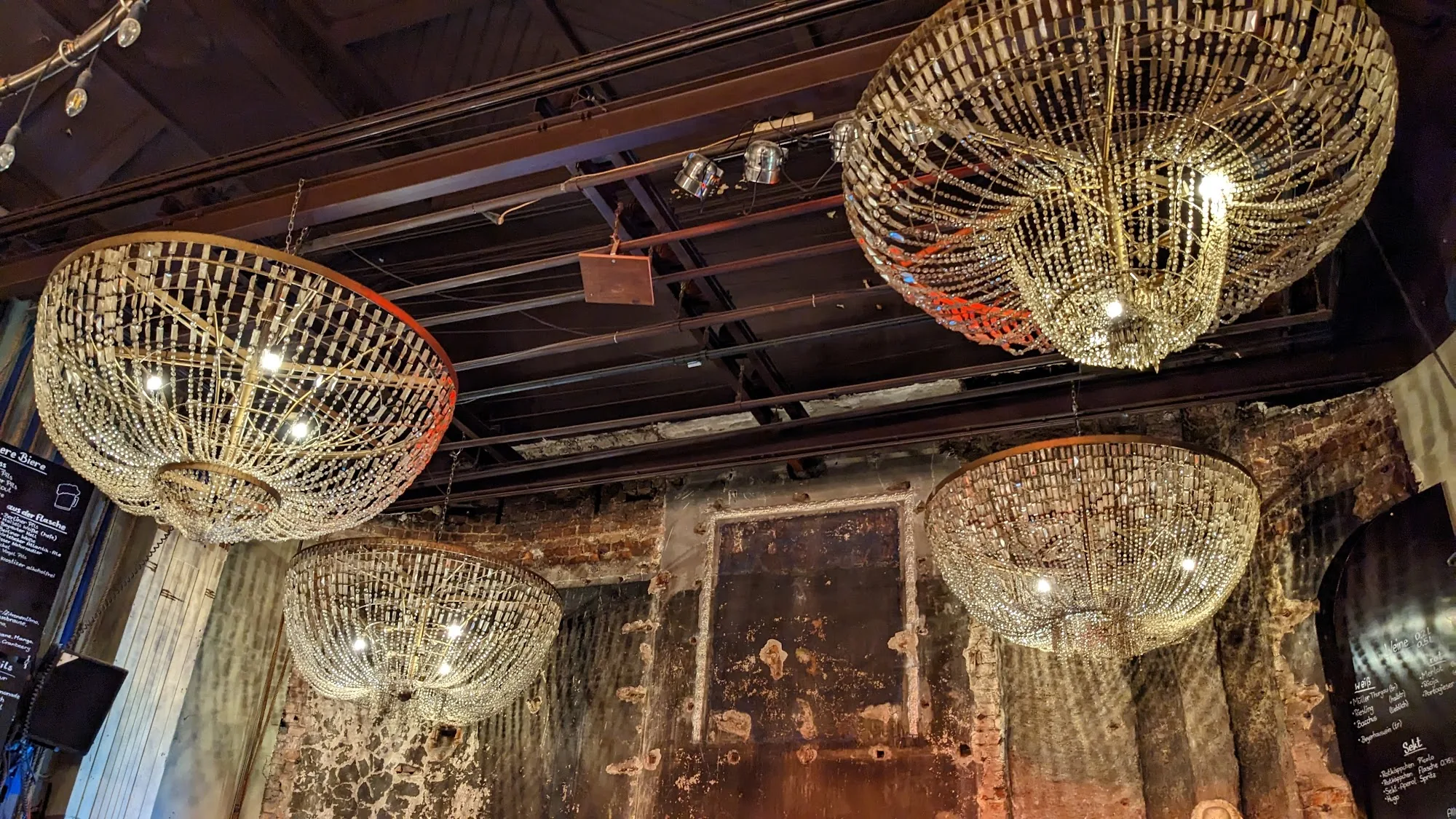 Beyerhaus ornate chandelier installation in venue interior