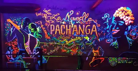 UV-lit Latin dance mural inside La Pachanga salsa and bachata club in Paris