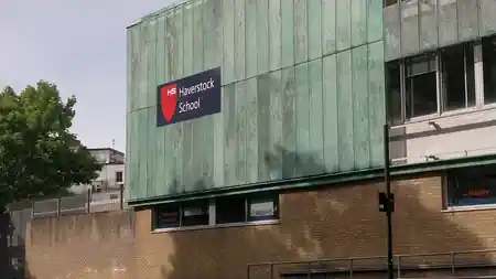 Haverstock School entrance with branded signage in London, host venue for Super Mario Salsa socials