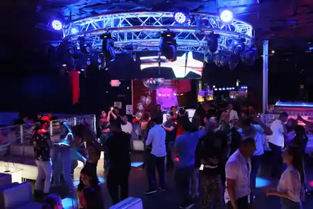 Packed dance floor with crowd and lights at V Lounge Bar Nightclub Los Angeles — salsa, bachata venue in Los Angeles