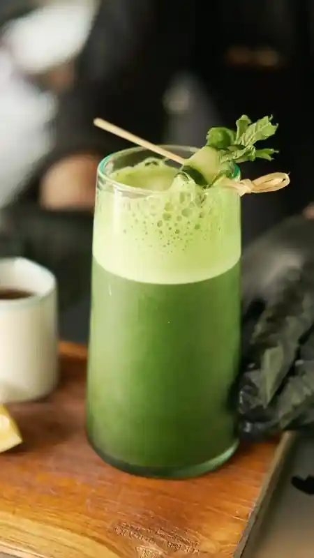 Fresh green juice garnished with cucumber and mint at Herb Library Ubud — bachata, salsa, kizomba venue in Bali