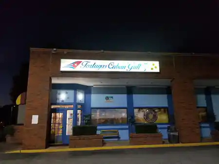 Tortuga Cuban Grill restaurant exterior at night with illuminated signage Atlanta — salsa, bachata venue in Atlanta