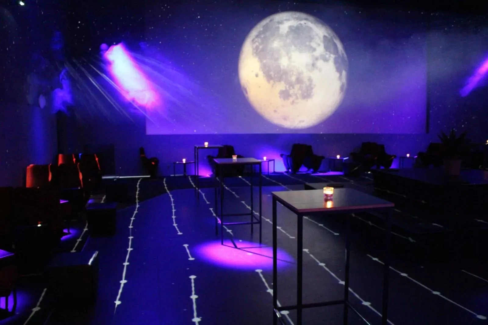 Moonlit projection over the empty dance floor at Moderne Bar & Karussell, Lucerne