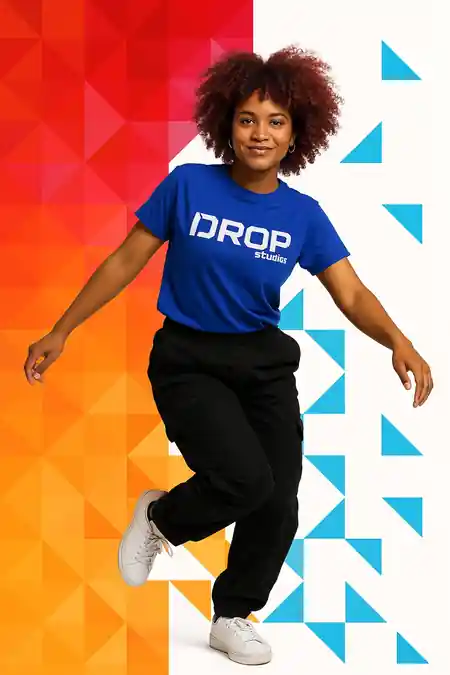 Dancer in DROP Studios branded shirt mid-step against the studio's red and blue brand graphics in Dublin — zouk venue in Dublin