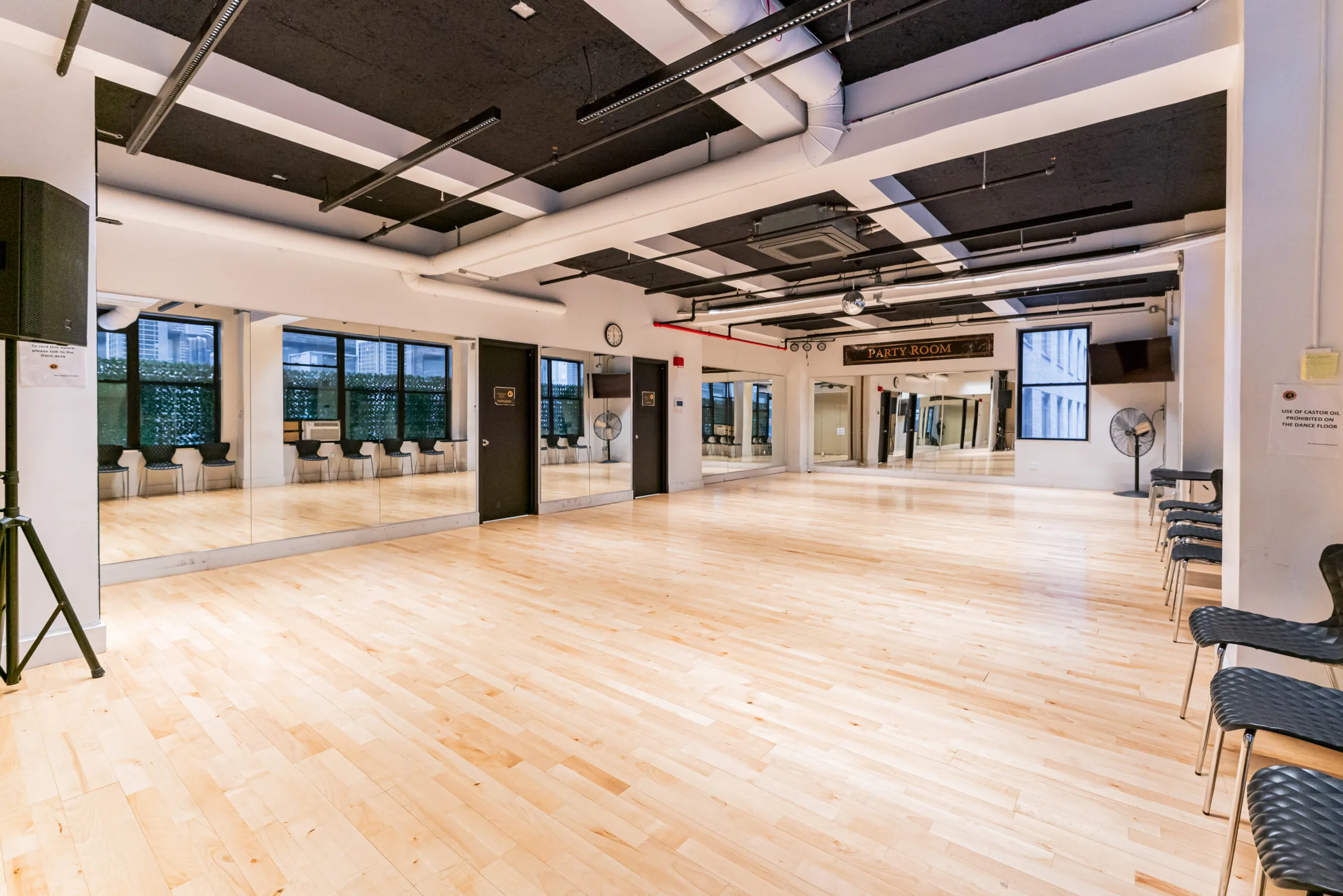 Spacious dance studio with mirrored walls and hardwood floor at EPA Dance Academy in New York