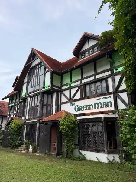 Tudor-style exterior of The Green Man pub with prominent signage in Phuket, Thailand — salsa, bachata, kizomba venue in Phuket