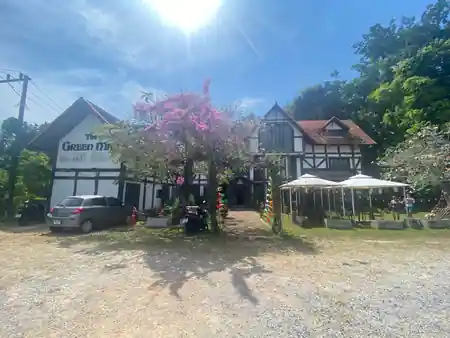 Daytime view of The Green Man pub exterior with garden seating in Phuket, Thailand — salsa, bachata, kizomba venue in Phuket