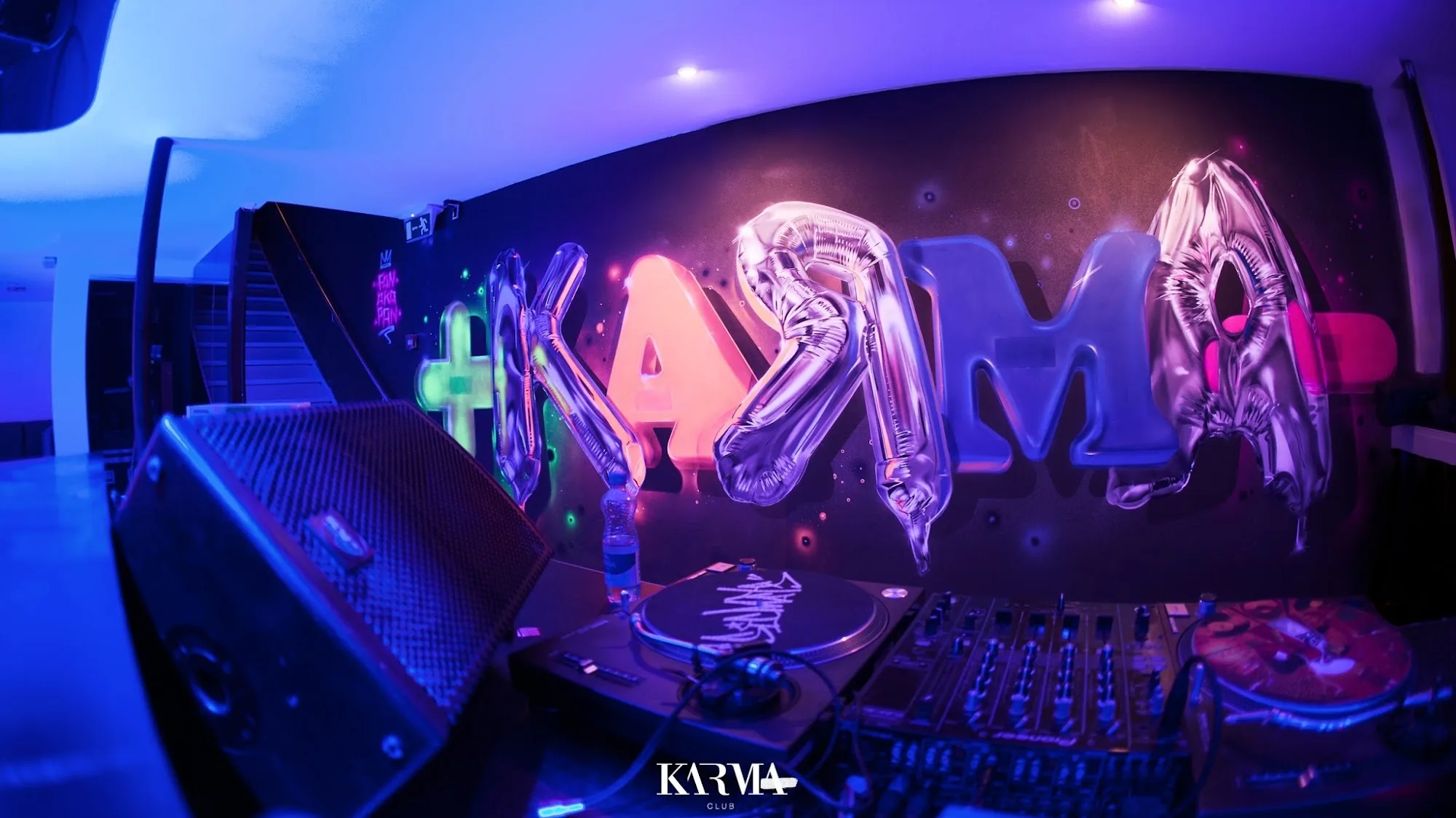Nightclub interior with dance floor and colored lighting at Karma Club Bern