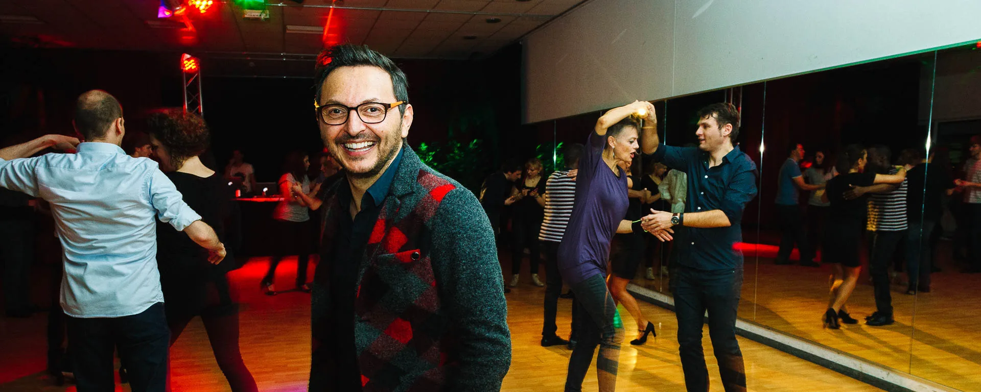 Dance floor with mirrored walls and dancing couples at Salsa Club Munich