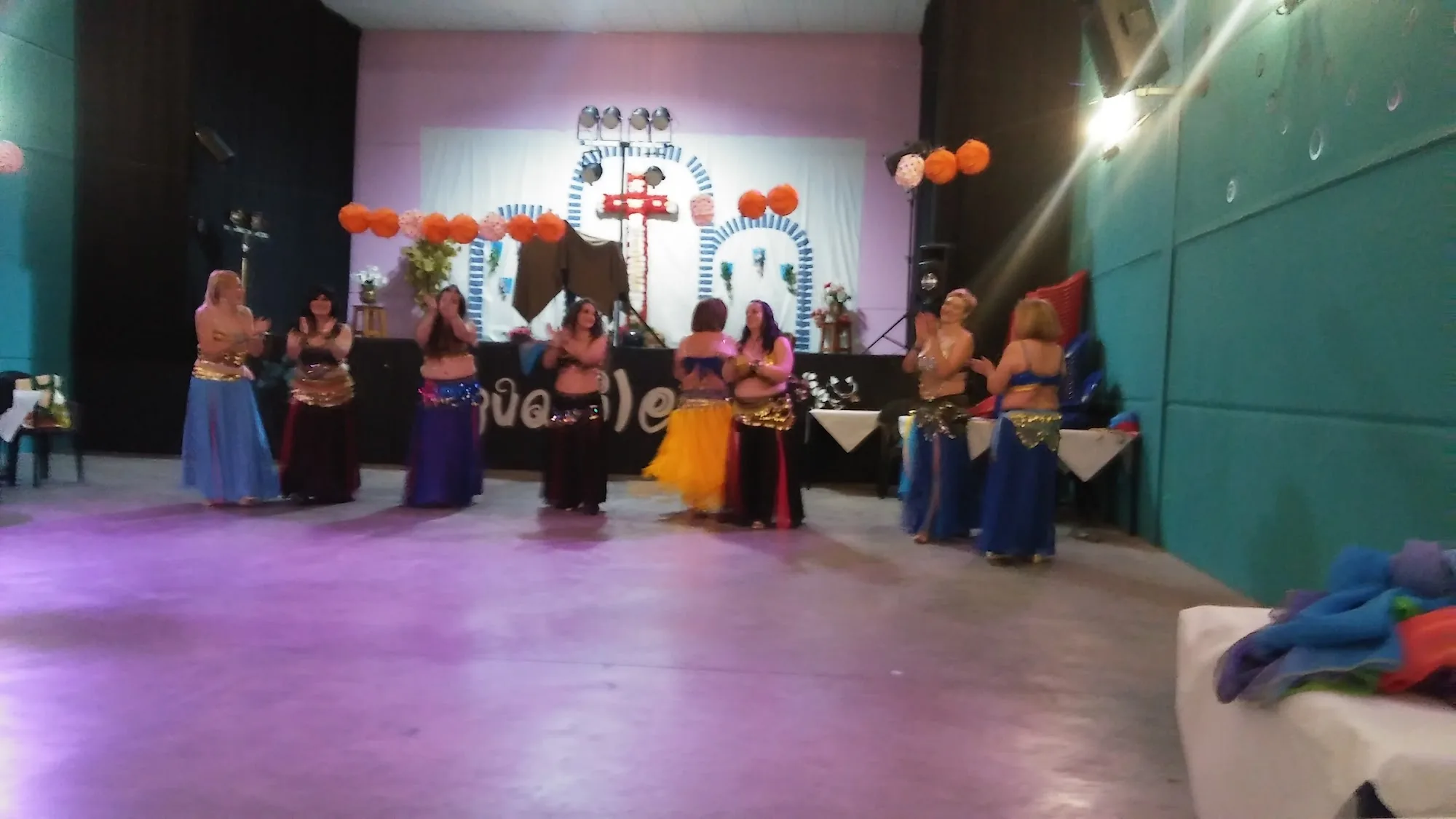 Group performance on stage at Sala Aguanile in Cordoba