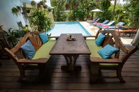 Poolside seating area at Greenlight Cafe with outdoor dining tables in Koh Samui — salsa, bachata, kizomba venue in Koh Samui