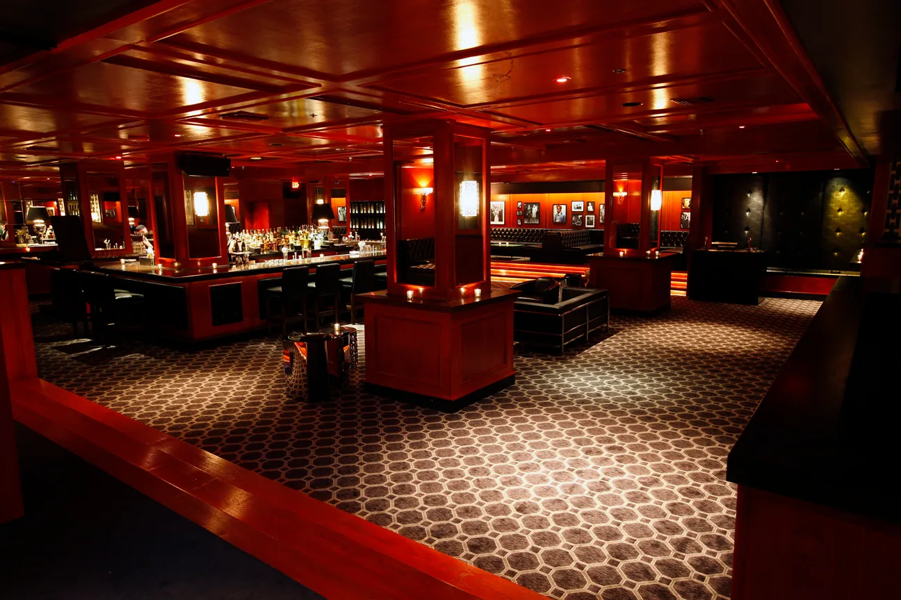 Intimate red-panelled club interior with dance floor at The Continental Club Los Angeles