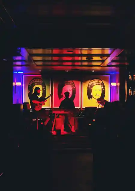 Live band performance on stage with pop-art backdrops at The Continental Club LA — salsa, bachata venue in Los Angeles