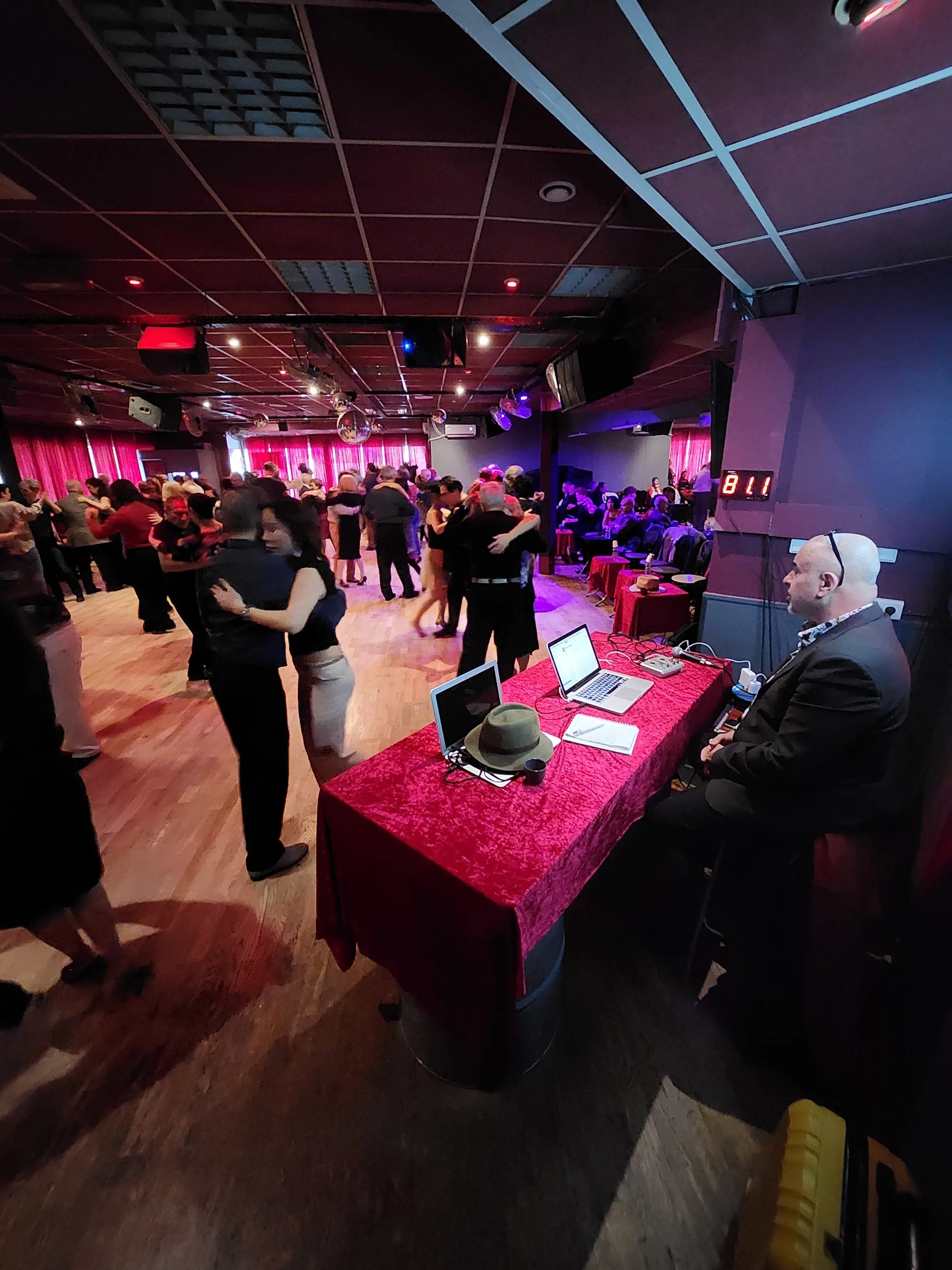 DJ booth and social dancers at a Sensation Dance School party night in Paris