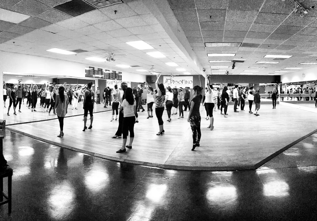 Salsa class in session in the mirrored studio at Pasofino Dance Atlanta
