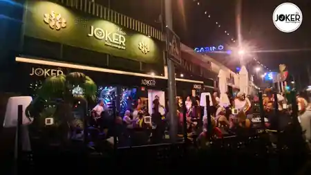 New Joker Music Lounge Bar Tomares — lively night exterior with crowd and Joker Music Lounge Bar signage — salsa, bachata, kizomba venue in Tomares