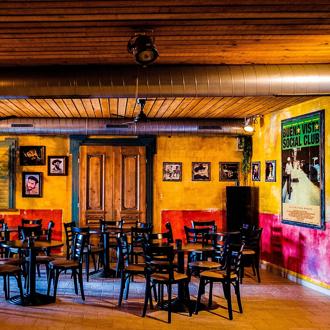Seating area with Buena Vista Social Club artwork at Azúcar Dansatelier, Brugge