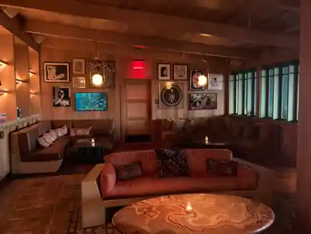 Cozy art-filled lounge with banquette seating at The Bungalow in Long Beach — salsa, bachata venue in Long Beach