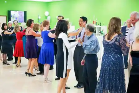 Social dance night at Sway Ballroom in Laguna Hills with couples dancing on a packed ballroom floor — salsa venue in Laguna Hills