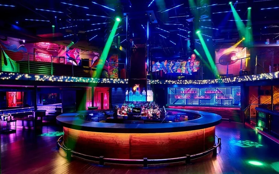 Tongue and Groove Atlanta lounge area with neon accents and VIP bottle service seating