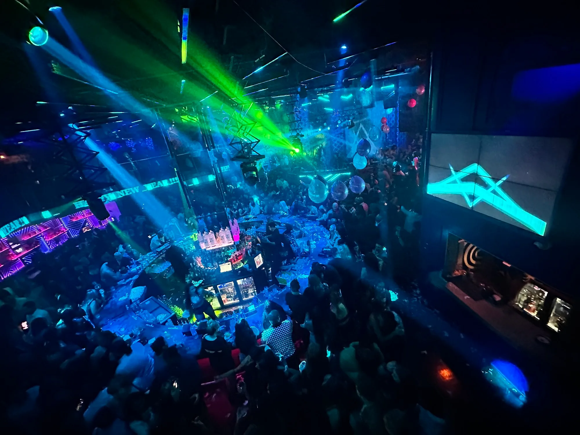 Aerial view of dance floor crowd with laser lights at Tounge and Groove Atlanta